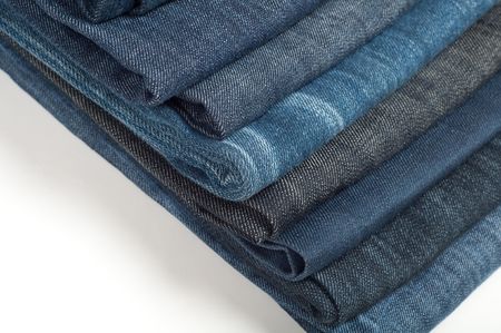  stack of denim blue jeansの写真素材