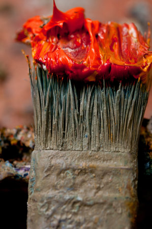 Paintbrush with oil paint on a classical palette