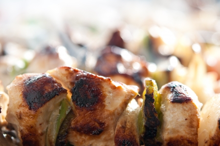 steaming chicken kebabs on the grillの写真素材
