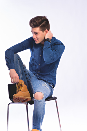 Male model in denim jeans . Studio shoot.の写真素材
