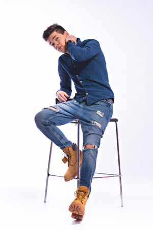 Male model in denim jeans . Studio shoot.の写真素材