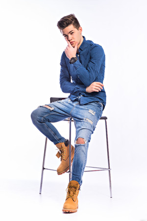 Male model in denim jeans . Studio shoot.の写真素材