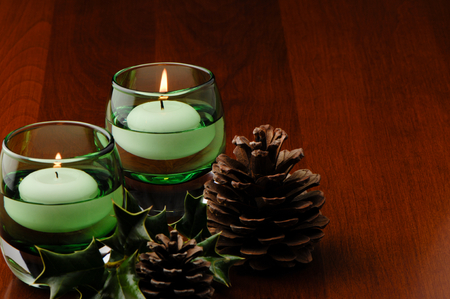 Holiday Table Decoration Candles Pine Cones Hollyの写真素材