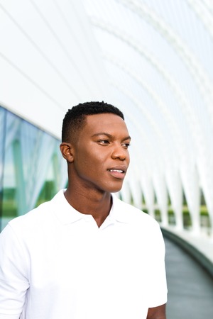 Black, African American college student on university campus not looking at cameraの写真素材