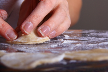 hand made ravioli getting prepared on table の写真素材