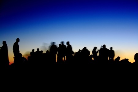 people silhouettes  on nemrut mountain waiting sunriseの写真素材