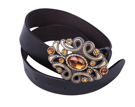 black lleather belt with decorative buckle on white backgroundの写真素材
