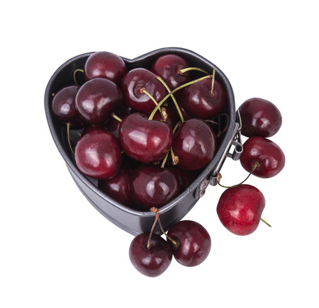 cherries into molds in the form of heart isolated on the white backgroundの写真素材