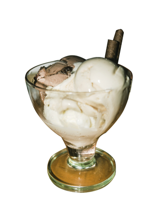 white and brown ice cream in a glass vase isolated on white backgroundの写真素材