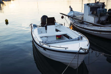 white big boat in summer evening sunset in the bayの写真素材