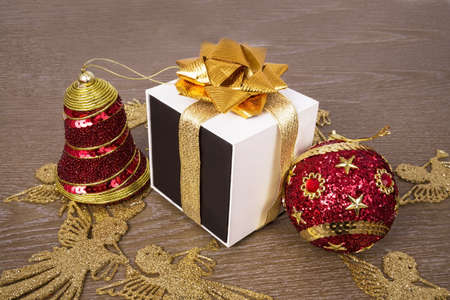 two Christmas toys and white and black gift boxの写真素材