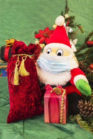 masked one Ð¡hristmas gnome with gifts and Ð¡hristmas treeの写真素材