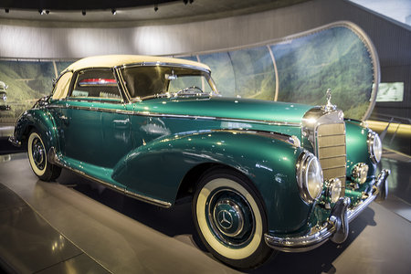 Stuttgart, Germany - December 13, 2017: Mercedes Museum. Ground view of the green retro car with another one at background.のeditorial素材