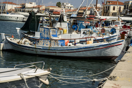 One Greek boat on the background of the port on the island of Aeginaの写真素材