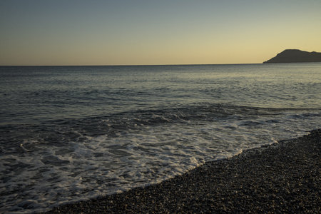Mediterranean Sea beach with a rocky island in Crete, Greece, Mediterranean Seaの写真素材