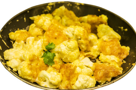 Cauliflower in a frying pan isolated on white backgroundの写真素材