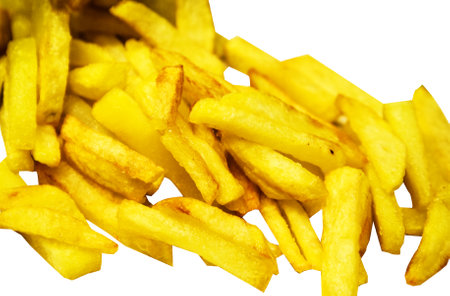 A close-up image of crispy golden French fries, showing their textureの写真素材