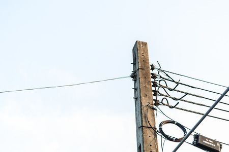 Electric pole with clear white sky.の写真素材