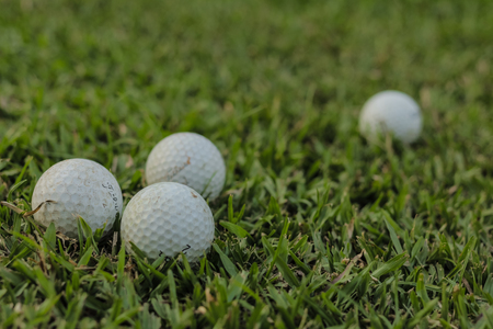 BANGKOK, THAILAND - APRIL 13, 2016: Golf balls on grass .の写真素材