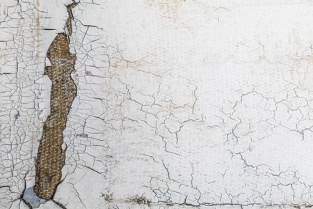 old cracked white wall broken.の写真素材