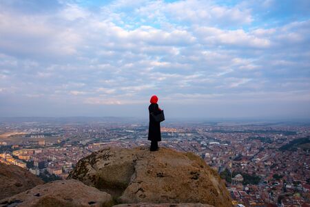 woman looking at the city in the Afyonkarahisar Castle in Turkey