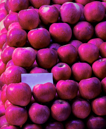 closeup shoot of the red apples in the raws at marketの写真素材