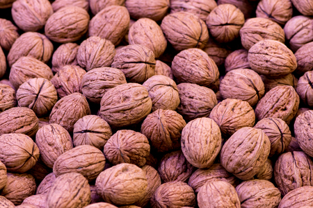 Closeup shoot of the walnuts as background at the marketの写真素材