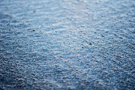 water covering sand on the beach making unique textureの写真素材