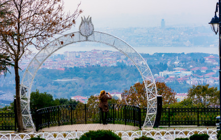 On 23 November girl is taking photo of Istanbul city from the Camlica hillのeditorial素材