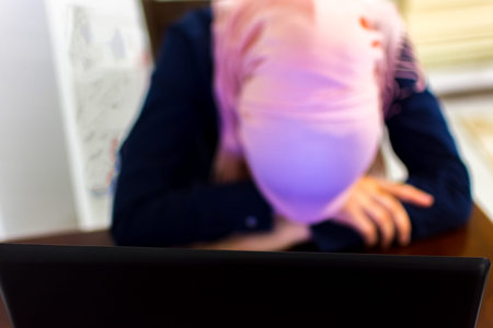 Tired muslim woman from work put head on the table