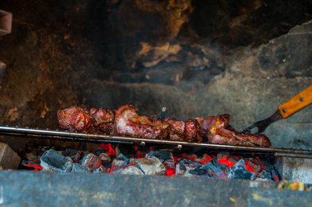 Beef meat cooking on the grill in the gardenの写真素材