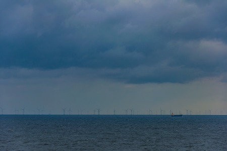 Windmills in the sea in the Germanyの写真素材