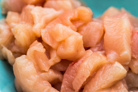 Closeup shoot of the small pieces of the chicken breast in the bowlの写真素材