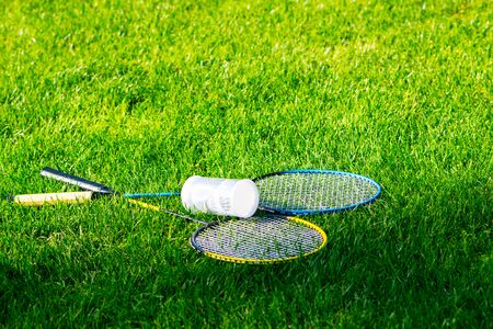 Tennis equipment left on the grass of stadium after the machの写真素材