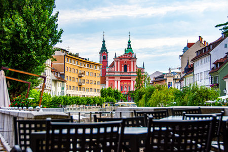 Empty restourant in the city of Ljubljana center, viewing to the river Ljubljanica and the churchの写真素材