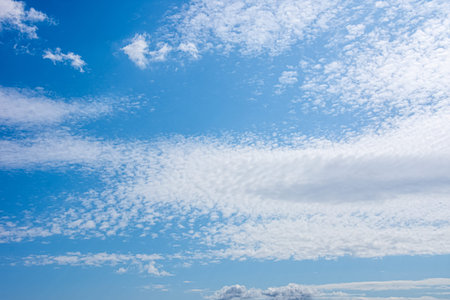 Beautifull blue sky with clouds dispersed all over the sky on a beautiful sunny day