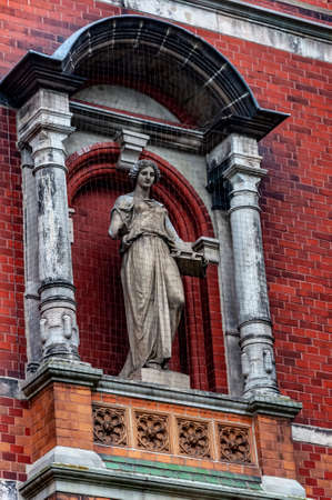 Statue of Mary with brick facade in the background close upのeditorial素材