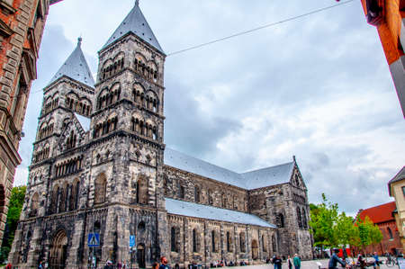 The exterior of main church of Lund or Lunds Domkyrka in city of Lund, Sweden 19. May 2014. Tourists visiting famous historical and religious attractionのeditorial素材