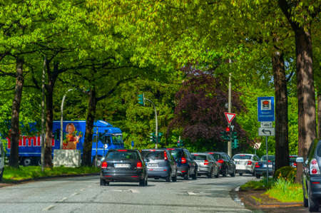 Cars stop in the line on crossroads for red traffic lightのeditorial素材
