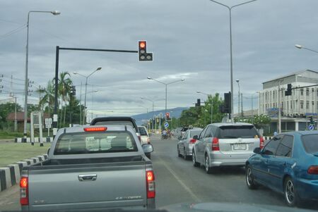 Sukhothai, Thailand, July 14th, 2018, Cars at the intersection behind stop line.のeditorial素材