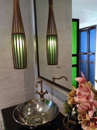 Sukhothai, Thailand, July 25th, 2018, Green lantern in toilet.のeditorial素材