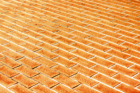 Flooring tiles  Brick sidewalk bordering the road 