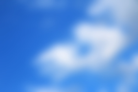 Blurry white clouds in blue sky. Sky backgroundの写真素材