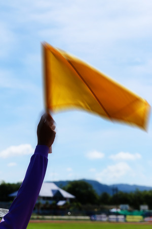 Motion blur yellow flag.の写真素材