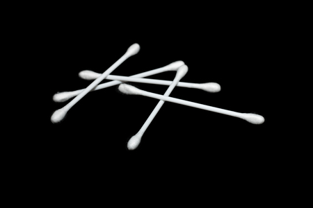 Cotton buds ,Cotton swabs on black backgroundの写真素材