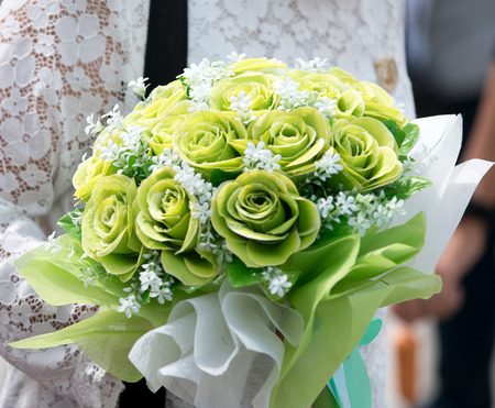 Bouquet of flowers in hand womanの写真素材