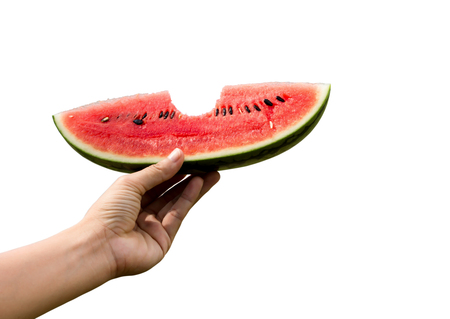 watermelon slices on hand in white background. (paths)の写真素材