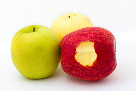 Red apple with leaf and slice on a white background の写真素材