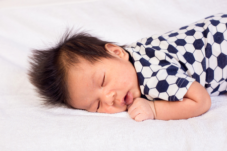 Newborn baby boy sleepingの写真素材