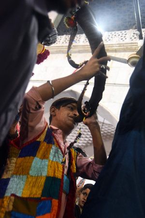 Hindu devotees carrying kavadi during Thaipusam festival.